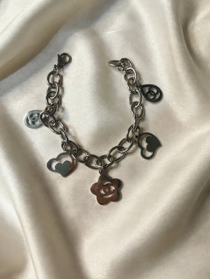 Gunmetal chain link charm bracelet with heart and flower charms
